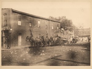 Six Mules Pulling Wagon Filled with Bales of Cotton on Unidentified Street by William G. Swekosky
